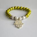 Bracelet by SIS: limonkowe korale z ręką fatimy przynoszoszącą