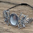 Srebrna bransoletka boho z ażurową ozdobą floral na czarnym sznurku