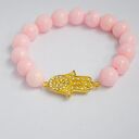 Bracelet by SIS: złota hamsa w jasno różowym marmurze