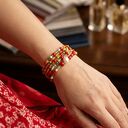 Wielorzędowa bransoletka boho na drucie pamięciowym - czerwień, szkło i perła