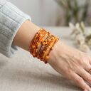 Bransoletki koralikowe BOHO 12w1 w kolorze pomarańczowym z kwiatkiem (handmade)