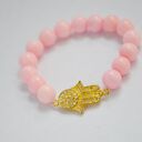 Bracelet by SIS: złota hamsa w jasno różowym marmurze