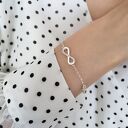 Srebrna bransoletka z symbolem nieskończoności i sercem