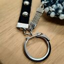 Brelok szydełkowy czarno-biały z ćwiekami i koralikami