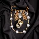 PREMIUM: broszka srebrno - złota z muszlą: efektowna, okazała