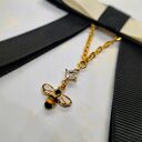 Czarna broszka z pszczółką - elegancka kokarda handmade