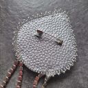 Broszka w kolorze srebra