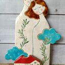Para bujająca w obłokach - ceramiczna dekoracja ścienna z miejscem na świeczkę