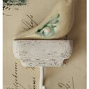 Wieszak z ptaszkiem o niebieskich skrzydłach