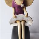 Anioł siedzący w beretce