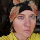 Ciepła czapka handmade z wełny merino z kwiatem - filcowana na podszewce