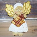 Pędzę z prezentem - anioł prezent, na szczęcie, z masy solnej