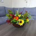 Dekoracja z dyniami. Kompozycja jesienna w wiklinowym koszyku