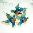 Turkusowe ptaki w locie - ceramiczne ozdoby wiszące