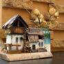 Stodoła - duży domek wykonany z fragmentów desek i belki sosnowej. Drewniane domki