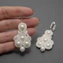 białe klipsy sutasz