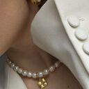 Złote kolczyki perły z plecionymi retro zawieszkami