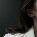 Złote kolczyki falowane koła