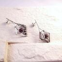 Srebrne kolczyki Caro z naturalnym granatem na sztyftach (wire wrapping)