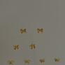 plecione kokardki z różowego złota - ozdobne kolczyki