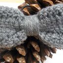 Wełniana kokarda do włosów - handmade na czarnej gumce