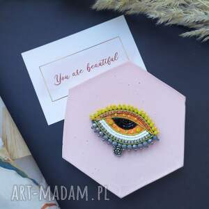 Aura accessories: broszka oko. biżuteria oko, pomarańczowa biżuteria