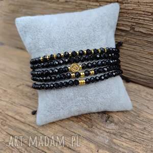 bransoletka na czarnym sznurku czerń i złoto hematyt z różą szkło