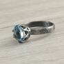 Piękny, oryginalny pierścionek wykonany ręcznie ze srebra próby 925 i 999 oraz fasetowanego topazu "sky blue" wielkości ok. Topaz