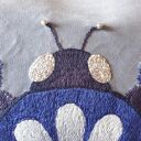 Poszewka z haftem chrząszcza -szept nocy