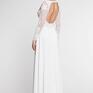 Suknia ślubna w niekonwencjonalnym wydaniu z nowej kolekcji. Góra wykonana z białej siateczki z naszywanymi haftami. Sukienki
