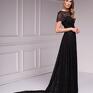Suknia wieczorowa z ekskluzywnej kolekcji Premium uszyta z luksusowej koronki w kolorze czarnym z brokatem, na podszewce. Studniówka