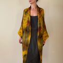 Kardigan „kokon” z wełny merino w brązach i żółtym - oversize