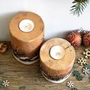 Dwa drewniane świeczniki z zimowym pejzażem