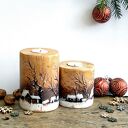 Dwa drewniane świeczniki z zimowym pejzażem