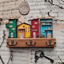 Wieszak z kolorowymi domkami no 1