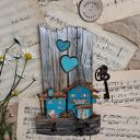 Rustykalny wieszak z tukusowymi domkami No 1