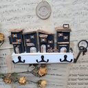 Wieszak z czarnymi domkami no 1