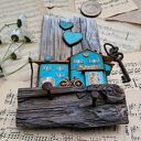 Rustykalny wieszak z tukusowymi domkami No 1