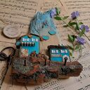 Rustykalny wieszak z turkusowymi domkami no 1