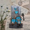 Rustykalny wieszak z tukusowymi domkami No 1