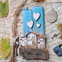 Rustykalny wieszak z domkami no 1