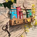 Wieszak z kolorowymi domkami no 1