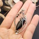 Srebrny wisiorek z czarnym onyksem - elegancka biżuteria handmade, unikatowy design