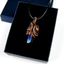 Wisiorek z kwarcem tytanowym - miedziana oprawa wire wrapping na rzemyku
