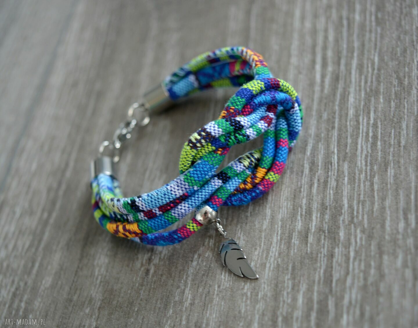 Bransoletka boho Azteq Knot z piórkiem ze stali szlachetnej