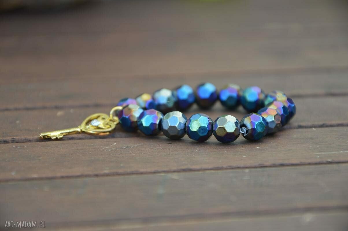 Bracelet by SIS: złoty klucz w otoczeniu czarnych szklanych korali AB