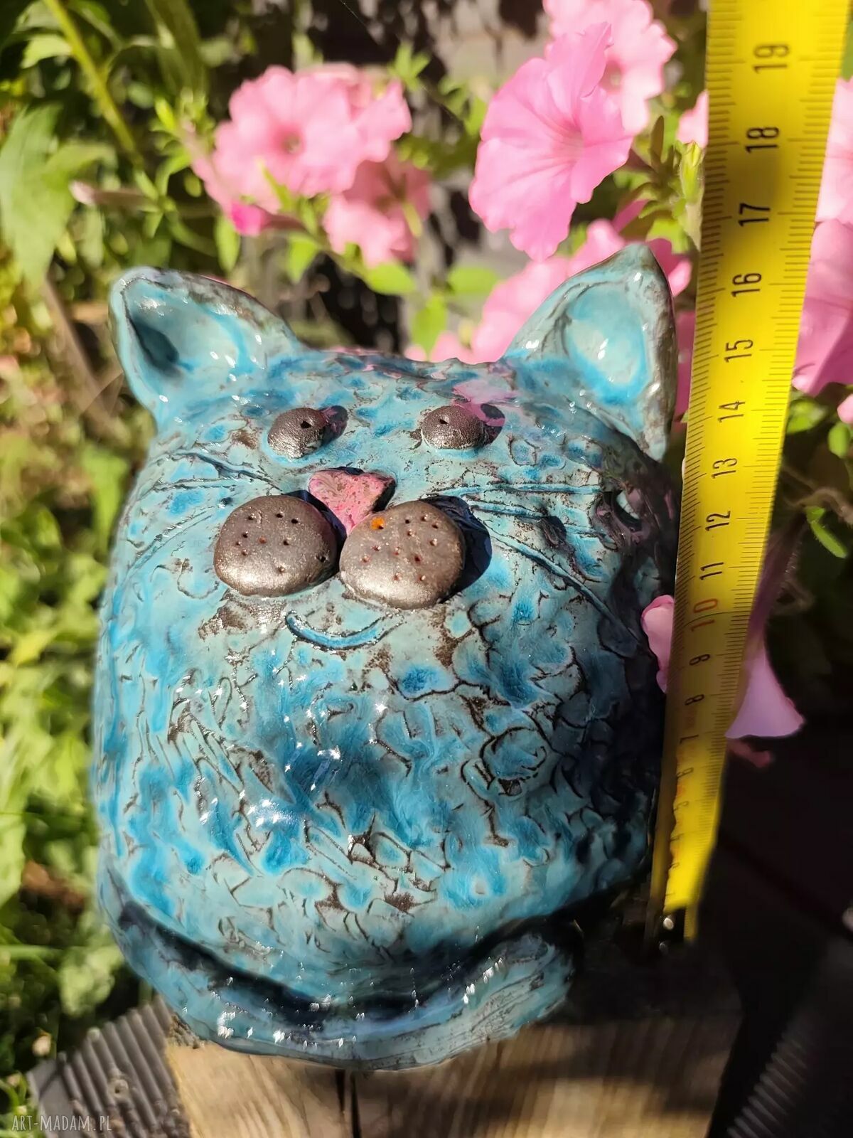 Ceramiczna skarbonka w kształcie grubego kotka