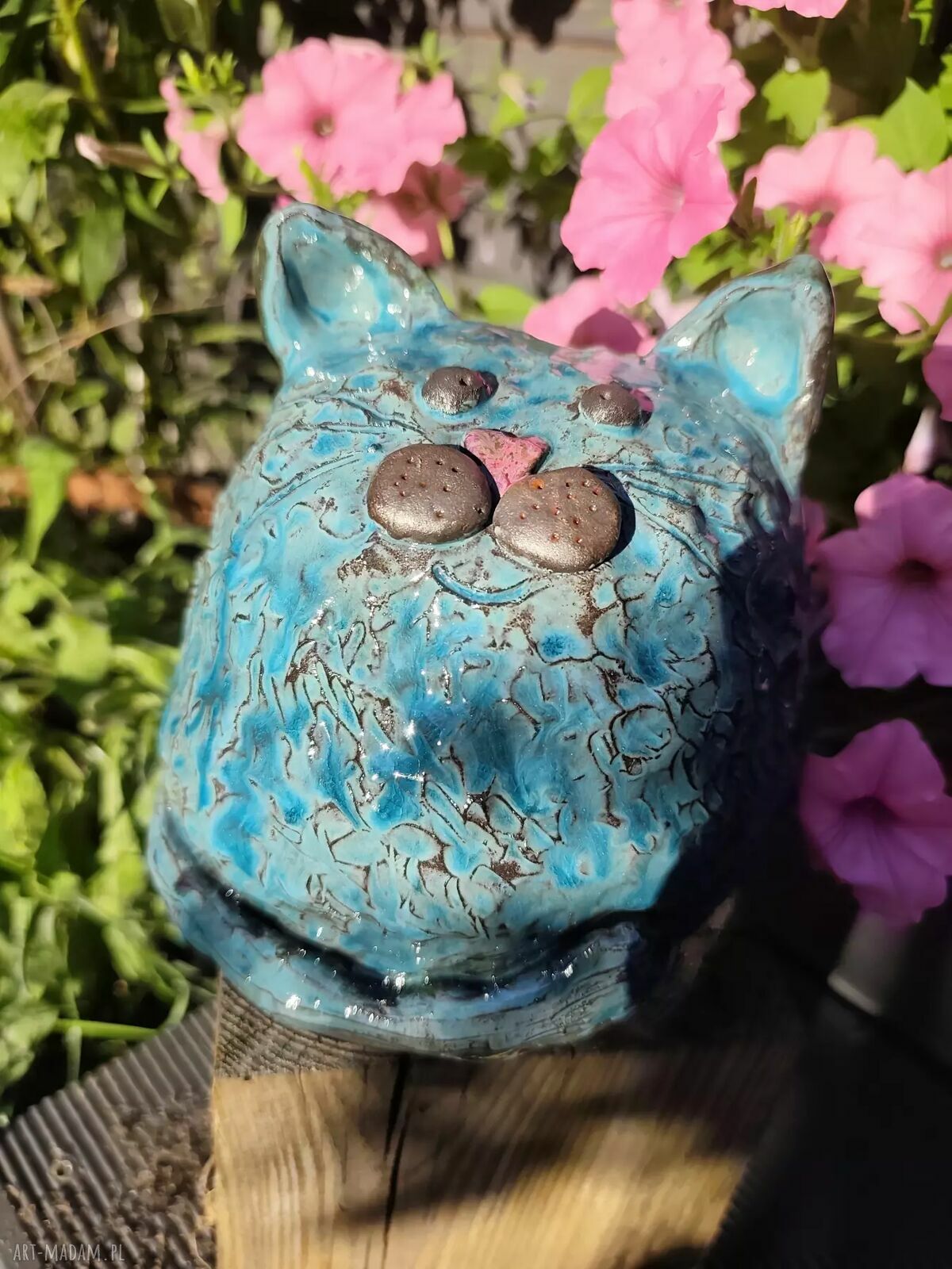 Ceramiczna skarbonka w kształcie grubego kotka