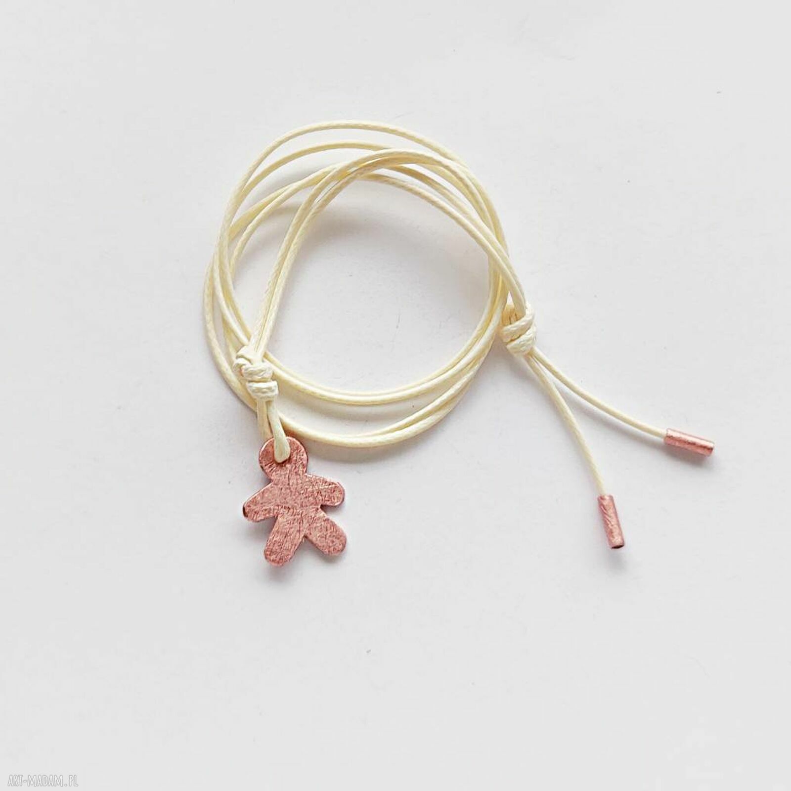 Słodki pamperek - wisiorek handmade z miedzi i sznurka